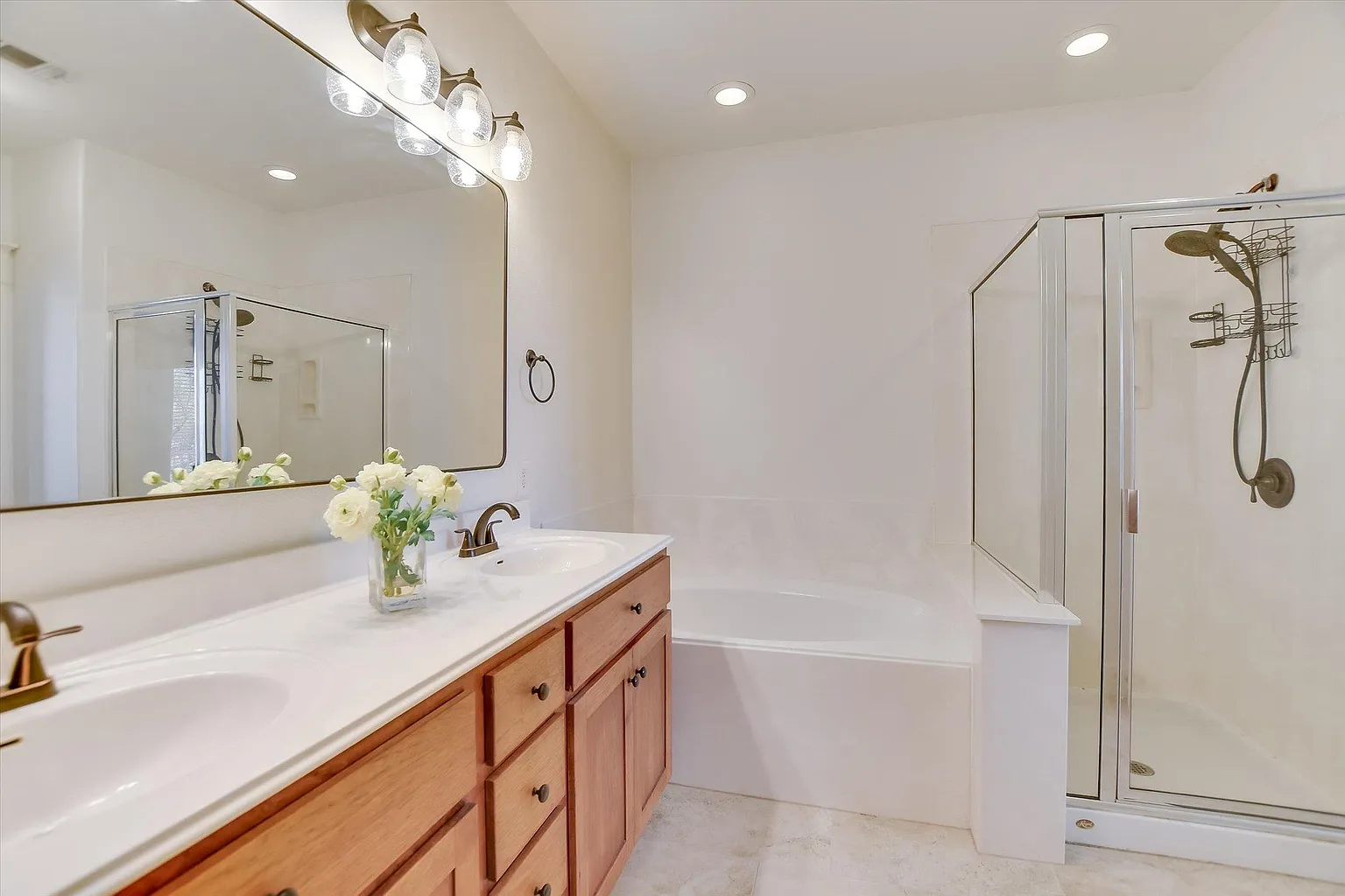 Main bathroom with walk-in shower and deep garden tub.